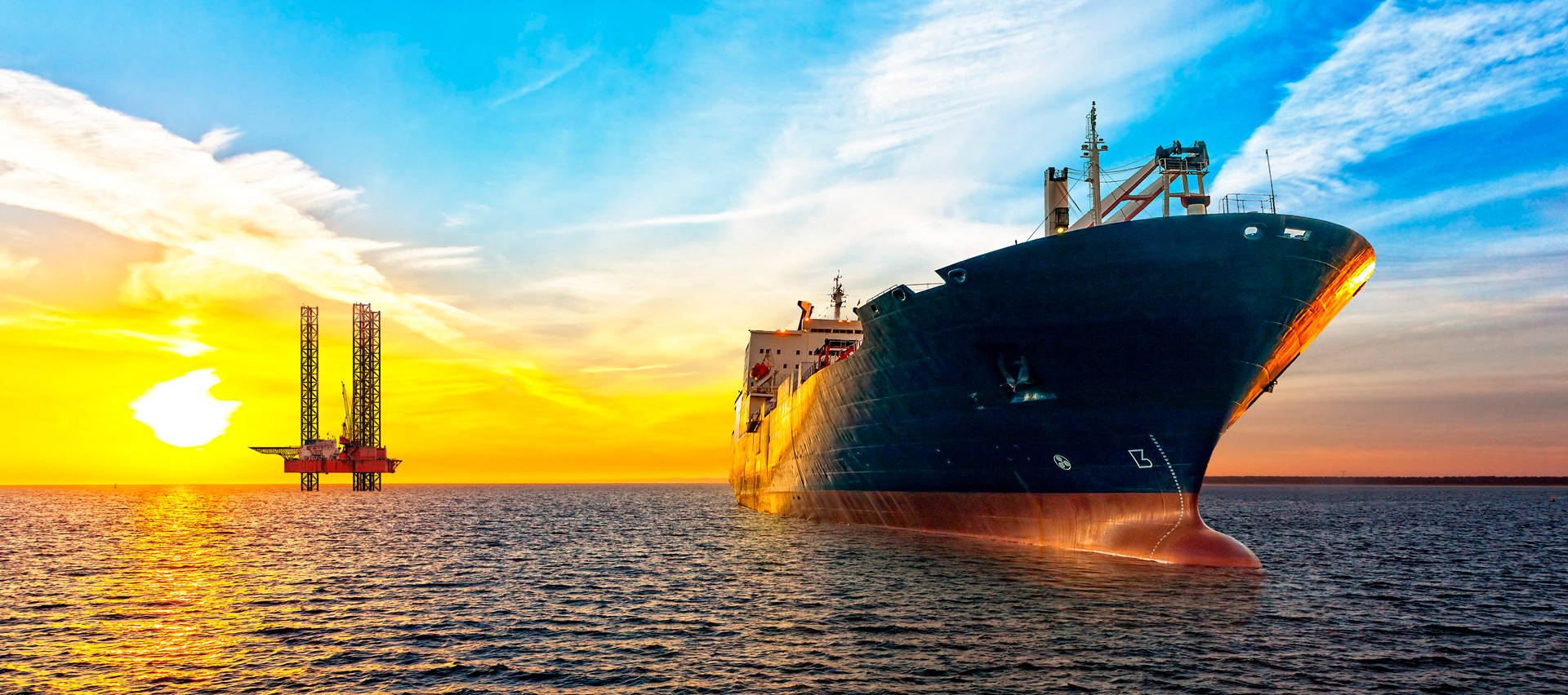 Offshore supply vessel near an offshore oil and gas platform at sea